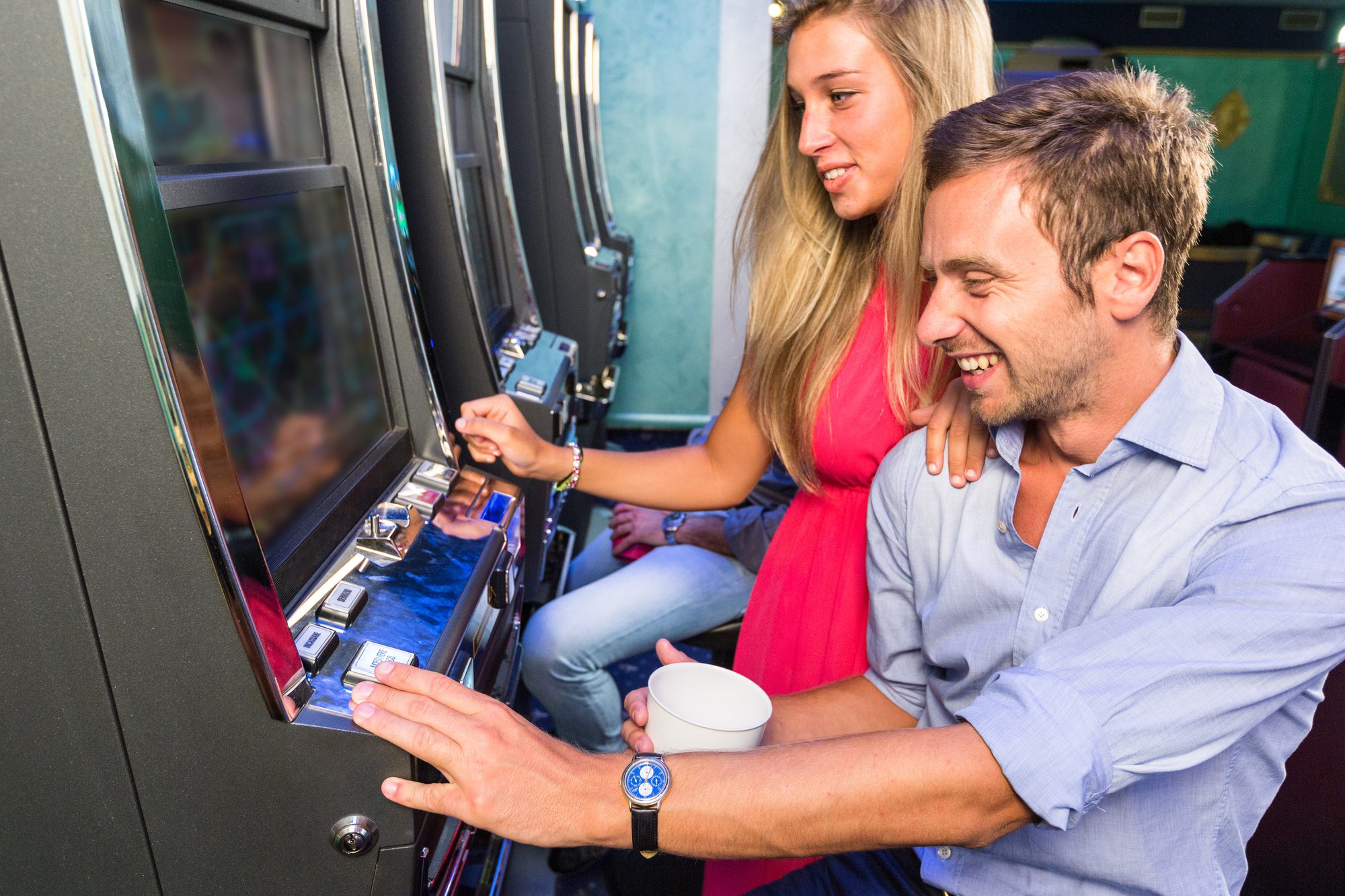 Group Of Friend Playing With Slot Machines